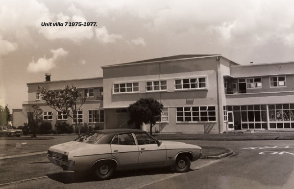 Photo of villa 7 building with a car parked out front